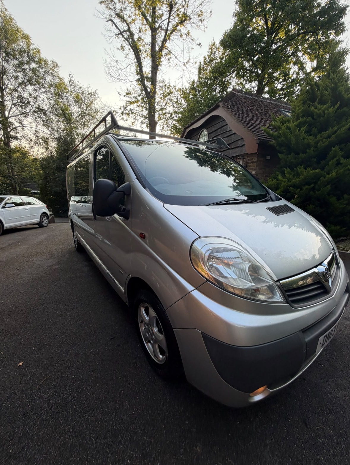 Professional car detailing being carried out on a glossy green car